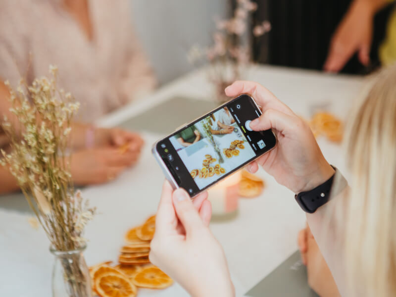 Hands taking a photo with a phone camera